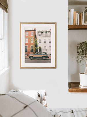 Classic car Jeep Wagoner framed photo print. With its timeless design and power, this beauty is an instant transport back to simpler days where you could easily get off the grid...or hop into the city from the 'burbs to see the Cherry Blossoms in full bloom in Washington DC! Welcome back to that amazing family weekend city adventure, all from the comfort of your smart home...wherever that smart home may be with this photo print "Old Town Wagoneer". 