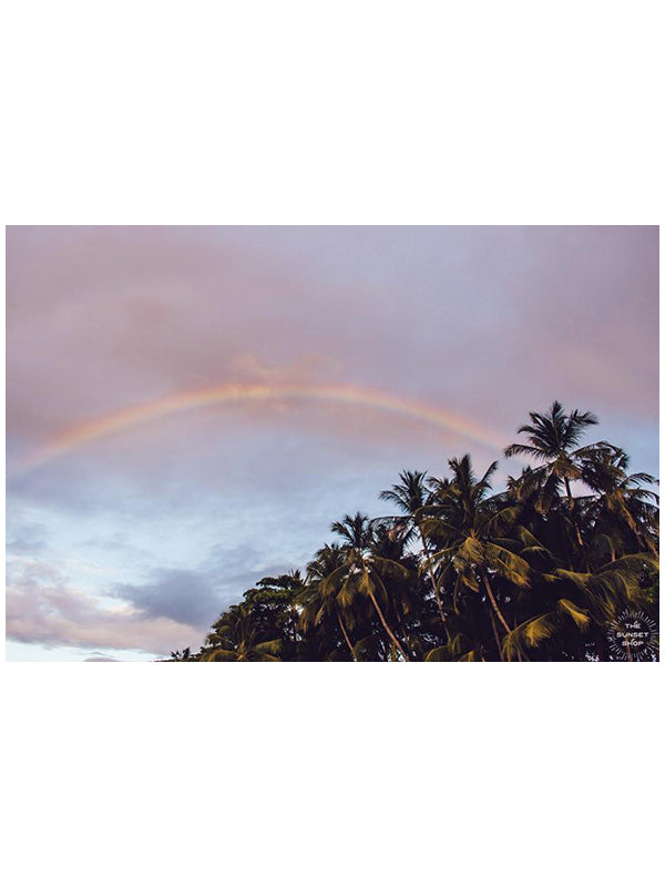 Rainbow over palm trees during sunset in Tamarindo Costa Rica. Photographed by Samba to the Sea for The Sunset Shop.