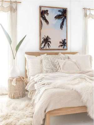 Dreamy beachy boho bedroom with breathtaking photography print of rainbow in between palm trees with a sunrise sky in Miami Florida. "Palmbow" photo print by Kristen M. Brown of Samba to the Sea, available at The Sunset Shop.
