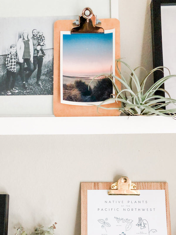 Full moon setting during a pastel pink sunrise on the Oregon Coast. "Pink Side of the Moon" sunrise beach print by Kristen M. Brown, Samba to the Sea. Coastal living Oregon Coast beach print shelfie on an industrial clipboard. 