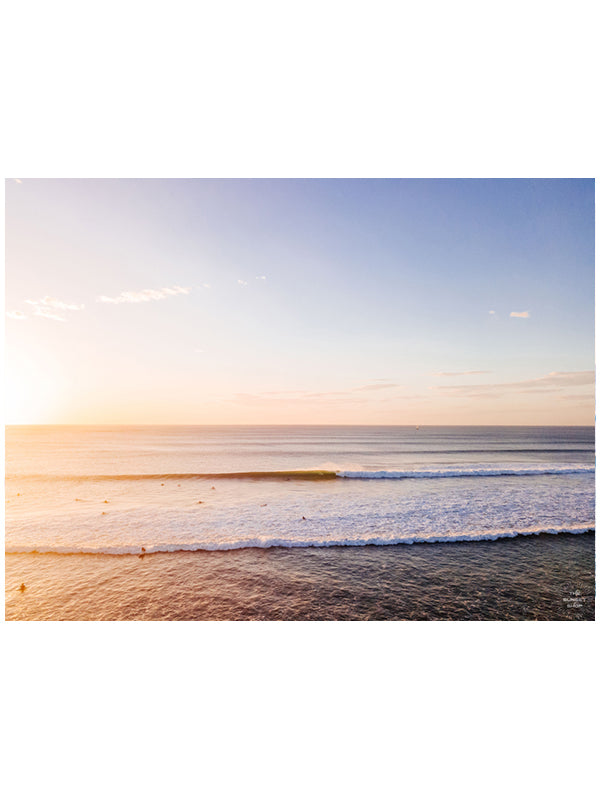 &quot;Playground&quot; aerial wave print by Samba to the Sea at The Sunset Shop. Image is an aerial photo of a wave breaking during sunset in Tamarindo, Costa Rica.