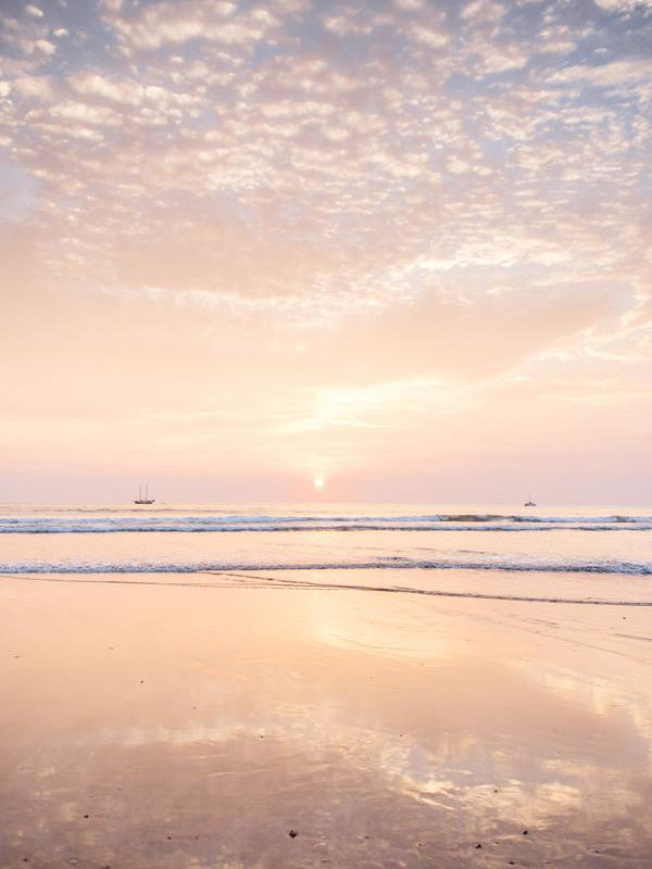 Beautiful pastel pink sunset in Tamarindo Costa Rica. Photographed by Samba to the Sea for The Sunset Shop.