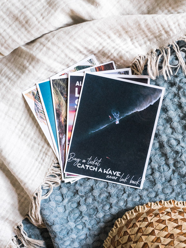 "Buy a Ticket" Costa Rica postcard. What's better than a text message from a loved one? Happy mail from a loved one! 📫💌 Grab this dreamy set of five postcards printed on 100% recycled card stock and start sending (or leaving in their bag!) some happy mail postcards to your mom, boyfriend/wife/significant other, best friend...and of course your grandma! By Kristen M. Brown, Samba to the Sea for The Sunset Shop.