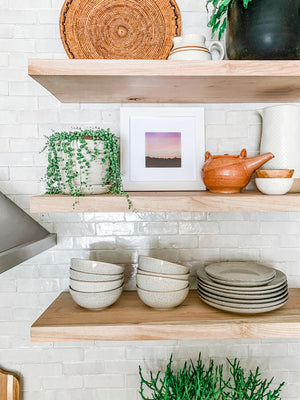 Mountain sunset shelfie print on open shelving in a beautiful kitchen. Pastel pink sunset sky over the Columbia Rive Gorge in Oregon. Sunset sky over the mountain ridge in Oregon. "Room At the Top" pastel sunset print by Kristen M. Brown, Samba to the Sea. Style by Girl and Grey.