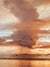 Rose Gold Rain sunset print by Samba to the Sea at The Sunset Shop. Image is a rain shower passing over the horizon during a rose gold sunset in Tamarindo, Costa Rica. 