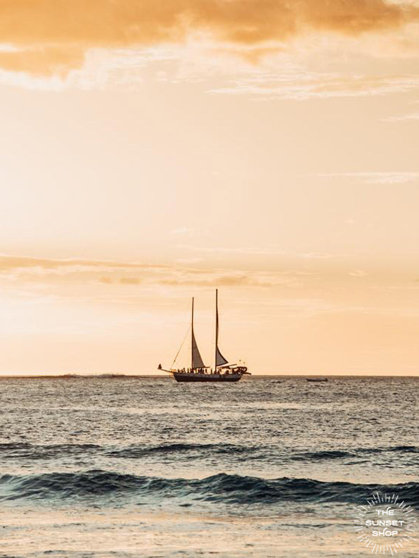 Golden sunset sail in Tamarindo Costa Rica. Photographed by Samba to the Sea for The Sunset Shop. 