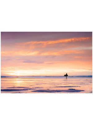 She's Magic sunset surfer print by Samba to the Sea at The Sunset Shop. Photo of a female surfer walking on the beach during a pastel pink sunset in Tamarindo, Costa Rica.