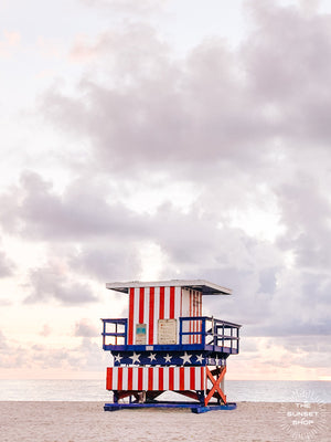 Pastel sunrise over South Beach in Miami with Stars and Stripes lifeguard tower. Photographed by Kristen M. Brown of Samba to the Sea for The Sunset Shop.