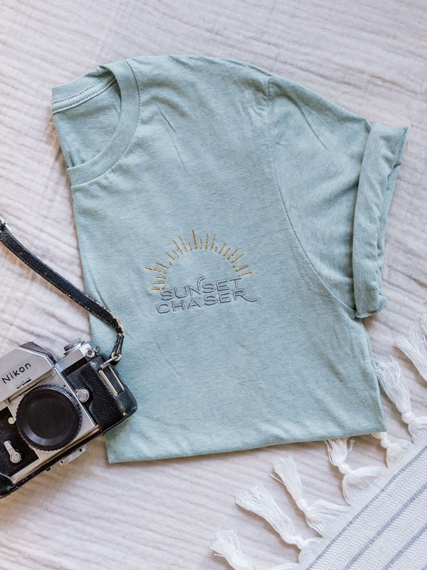 Calling all sunset chasers! There&#39;s nothing like ending the day watching the sun pass over horizon, painting the sky in magical colors...and now you can chase sunset while rocking this super comfy, relaxed Sunset Chaser tee! Embroidered with silver and gold thread, you won&#39;t want to take this tee off — it&#39;s that stylish AND comfortable!!! Click here to check this tee out! Available at The Sunset Shop by Kristen M. Brown, Samba to the Sea.