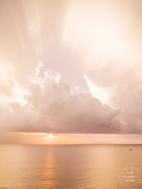 If it requires bare feet, the beach and a magical sunset, your answer is always yes. Instantly transport yourself to summertime at the beach with this breathtaking sunset with the suns rays breaking through the clouds in Costa Rica. Photo by Kristen M. Brown, Samba to the Sea for The Sunset Shop.