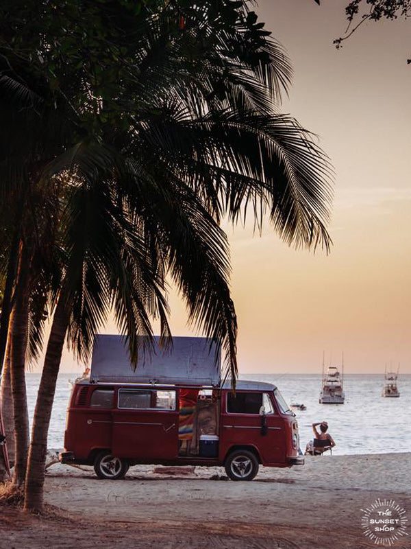 The Sunset Bus print by Samba to the Sea at The Sunset Shop. Photograph of a VW Bus on the beach in Tamarindo, Costa Rica during sunset.