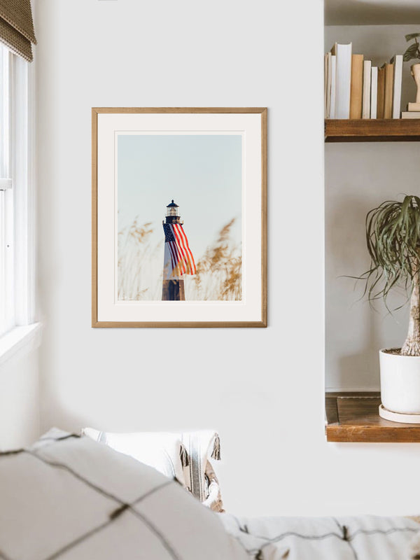 There she was, dancing in the sea breeze with the sea grass and shimmering in the late afternoon sun! Majestic American flag hanging from the Tybee Island Lighthouse in Tybee Island, GA. "Sweet Liberty" photographed by Kristen M. Brown, Samba to the Sea for The Sunset Shop. Coastal Americana home wall art.