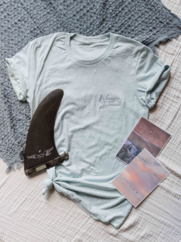 Calling all wave dancers! There's nothing quite like the blissful feeling of the rhythm of the wave flowing through your whole body...and now you can show your love for surfing with this super comfy, relaxed fit Wave Dancer tee! By Samba to the Sea at The Sunset Shop.
