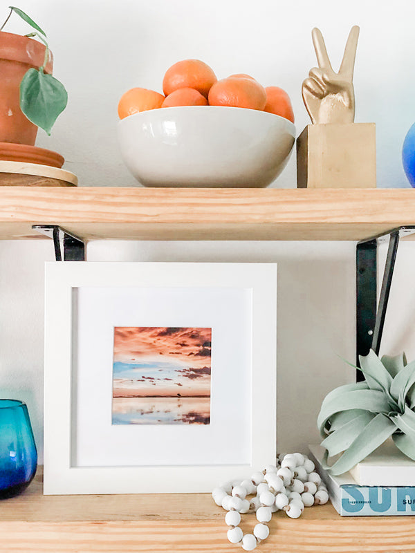 Framed sunset surf beach photo. Surfer walking on the beach during a beautiful sunset in Costa Rica. Sunset surfer print by Samba to the Sea at The Sunset Shop.