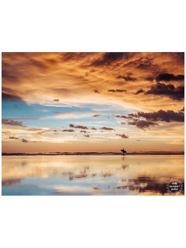 Surfer walking on the beach during a beautiful sunset in Costa Rica. Sunset surfer print by Samba to the Sea at The Sunset Shop.