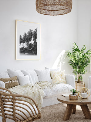 White boho rattan living room with black and white palm trees and surfboards photography print Costa Rica. Fine Art Photos by Kristen M. Brown of Samba to the Sea for The Sunset Shop.
