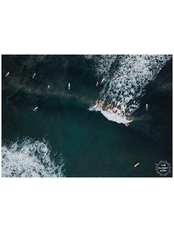 You Go Left and I&#39;ll Go Right aerial surfer print by Samba to the Sea at The Sunset Shop. Image is an aerial photo of surfer&#39;s splitting the peak in Tamarindo, Costa Rica.